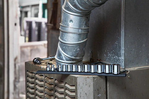 Three-Eighths Inch Drive 12 Point Standard Socket Set SAE 13 Piece with chamfered openings on industrial equipment