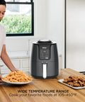 Top Rated Air Fryer With Four In One Cooking Functions For Crispy Roasting Versatile Temp Control And Fully Dishwasher Safe Basket Delivers Low Stress Kitchen Vibes And Straight Up Delicious Results Daily on kitchen counter with fries and chicken.