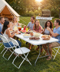 Group enjoying outdoor meal on 8 Feet Folding Picnic Table With Carry Handle, Heavy Duty Portable Plastic Table for Camping, White.