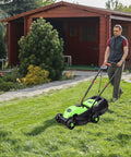 Power Through Your Yard With This 12.5 Amp 1200W Corded 13 Inch Push Lawn Mower That Cuts Clean, Tames Thick Grass, And Starts Easy, A Lightweight Green Machine Built For Quick, No Fuss Yard Maintenance. Green 13-inch corded push lawn mower on grass with collection bag