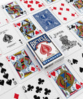 Standard Two Pack Playing Cards In Red And Blue Optimized For Tight Fan And Buttery Smooth Shuffle Heavy Duty Stock Built Like A Tank For Relaxed Handling During Cash Games And Tabletop Hangouts laid out on a surface