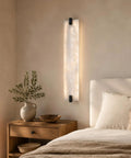 22" Natural Square Alabaster Marble Modern Bathroom Black Wall Sconce mounted next to bed with cozy linens.