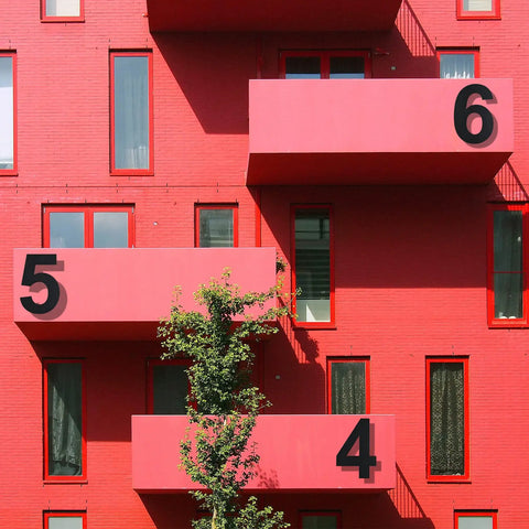 Red building facade with large numbers on balconies, not related to Modern 12 Inch Outdoor Address Number 2 In Stainless Steel Floating Design Weatherproof And Durable Exterior House Sign