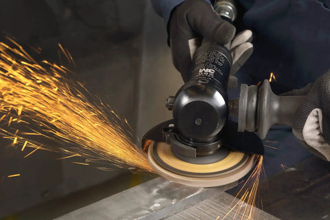 Cubitron II Flap Disc 967A T27 4-1/2 In By 7/8 In Pack Of Ten 60+ Grit in action, grinding metal surface, producing sparks