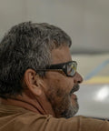 Man wearing Polarized Safety Glasses With High Impact Rating Z87.1 Plus Non Slip Protective Eyewear in workshop