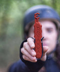 Person holding red quick fix bike chain tool, Get Your Chain Back On Your Bike In Three Seconds Without The Mess Quick Fix For Bike Maintenance On The Go