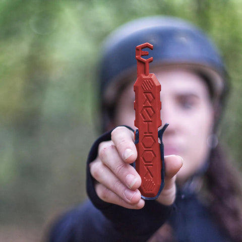 Person holding red quick fix bike chain tool, Get Your Chain Back On Your Bike In Three Seconds Without The Mess Quick Fix For Bike Maintenance On The Go