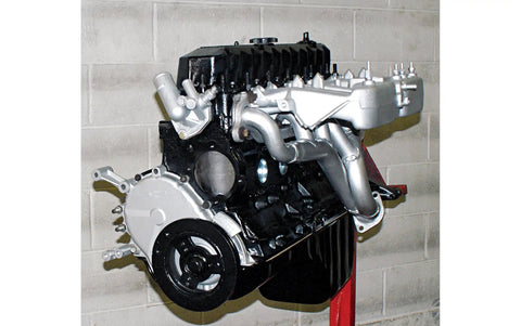 4.0L Inline Six Engine Rebuild And Modification Guide with rebuilt Jeep inline-6 engine shown on stand