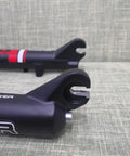 Close-up of Beefy Fat Tire Electric Bike Front Suspension Fork ends for 20 inch 4.0 wide tires, 135mm hub spacing, manual lockout.