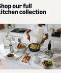 Person cooking with various kitchen tools and pots on a white counter.