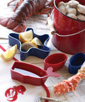 Seafood Shell Cracker And Picks Set, 5 Piece, Heavy Duty Zinc Alloy Nutcracker with lemon wedges and seafood on table