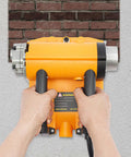 Hands holding a Heavy Duty Electric Wall Planer For Floor Tile Removal 4580W Motor 3500 RPM against a wall.