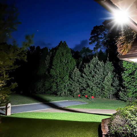 Heavy Duty Outdoor LED Flood Light 150W 13500LM 6000K Daylight White illuminating a yard at night, showing bright security lighting