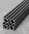 Kickstart Your Next Fabrication Build With This Beefy 6060 T Slot Aluminum Extrusion Profile Black Matte Finish 1000 mm Length stacked aluminum profiles on marble surface.