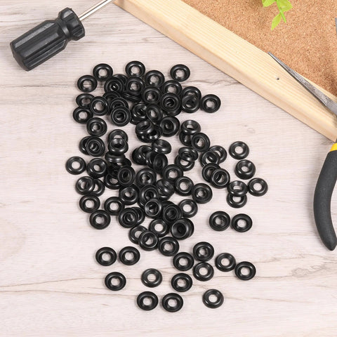Black stainless steel #8 countersunk cup washers, 200 pcs; top view on wood with tools