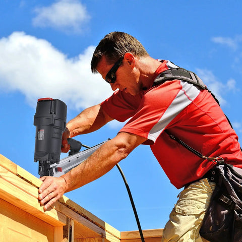Worker using 9021N/NS 21 Degree Framing Nailer With Depth Adjustment, 3-1/2 Inch Nails on roof structure