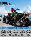 Retractable Ratchet Straps 12Ft Auto Rewind Cargo Tie Down Straps securing ATV on truck with sea view.