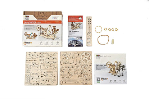 Tachometer Model Kit For Adults, Hands On Wooden STEM Puzzle components and assembly instructions spread out.