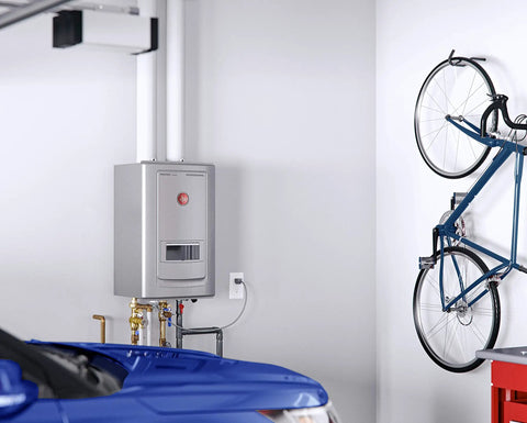 Rock Solid Indoor Natural Gas Tankless Water Heater With Built In Recirculation And Automatic Leak Shutoff visible in a garage.