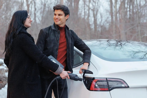 Couple using Go-To Portable Level 2 EV Charger With 40 Amp Output, 25ft Cable, 120V To 240V NEMA 14-50, Outdoor EVSE