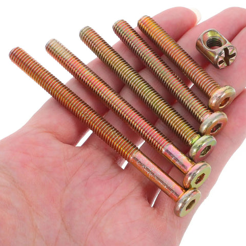 Hand holding Forty Nine Piece M6 Hex Drive Screws And Barrel Nuts Set For Furniture Repair And Bed Frame Connections, length 40-80mm