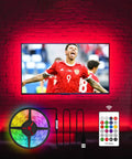 Led Backlight Kit For 60-65 Inch TVs, 15 Ft Behind Monitor Lights, shown with remote and glowing TV, enhancing visuals.