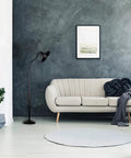 Open Frame Drafting Lamp Style Floor Lamp In Oil Rubbed Bronze next to a beige sofa in a modern living room setting.