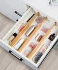 Premium Expandable Bamboo Drawer Dividers six pack organizing makeup in a drawer, dimensions 16 to 22 inches.