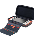 Game Traveler Deluxe Licensed Travel Case For Nintendo Switch Family, open with Switch console and game card holder visible.
