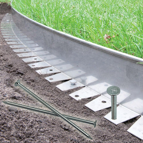 Heavy Duty 6 Inch Metal Nails 144 Pack Landscape Anchoring Spikes For Paver Edging Weed Barriers Turf Tent Stakes And More Ideal For Yard Construction Carpentry Projects, shown securing landscape edging in garden soil