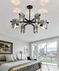 Six Light Black Glass Chandelier Pendant Lighting Mid Century Ceiling Fixture in bedroom with modern decor.