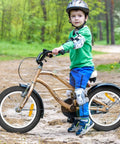 Child riding a bike with Two Pack 18 Inch Kid Bike Tires 18 X 2.125 With Inner Tubes Fits 18 Inch Bicycles BMX MTB in a forest path.