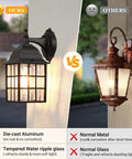 Comparison of Dusk To Dawn Outdoor Wall Lights 2-Pack With Sensor Exterior Fixtures showing black sconce with water ripple glass vs corroded metal