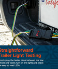 4 Way Flat Trailer Light Tester For 4 Pin Wiring System Inline Between Your Tow Rig And Trailer With Easy Read LEDs To Isolate Wiring Problems Fast And Keep Your Trailer Lights Working Right. black 4-pin inline tester with lit LEDs on trailer hitch step