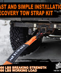 Heavy Duty Tow Strap Recovery Kit attached to truck during off-road use in snowy conditions.