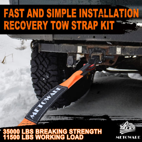 Heavy Duty Tow Strap Recovery Kit attached to truck during off-road use in snowy conditions.
