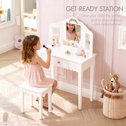 A girl using a Kids Vanity Table Set With Gold Bow for Little Girls in a playroom, featuring a white wood makeup desk and mirrors.