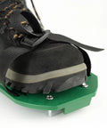 Lawn Aerator Spiked Shoes With 13 Nails Each For Lawn Aeration Scarifier Footwear Nail Shoes One Size Fits All Black Green Durable Adjustable Straps No Fuss To Use Lawn Care Tool For Healthy Green Turf on foot, showing green base and straps