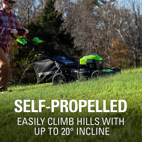 Man pushing 40V 21-Inch Self-Propelled Lawn Mower With Brushless Motor And Traction, easily climbing a hill.