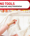 Person using Clear Variety Pack For Damage Free Hanging with clear hooks for easy setup, no tools required.