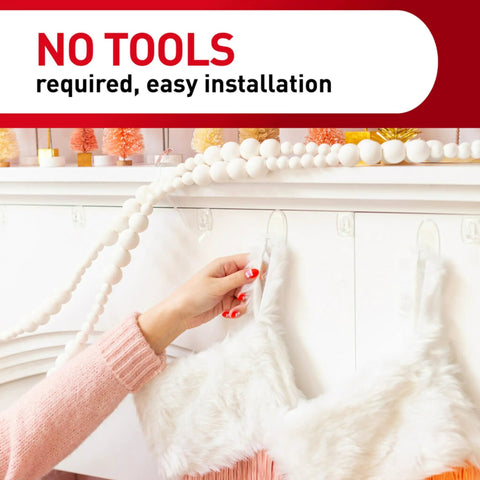 Person using Clear Variety Pack For Damage Free Hanging with clear hooks for easy setup, no tools required.