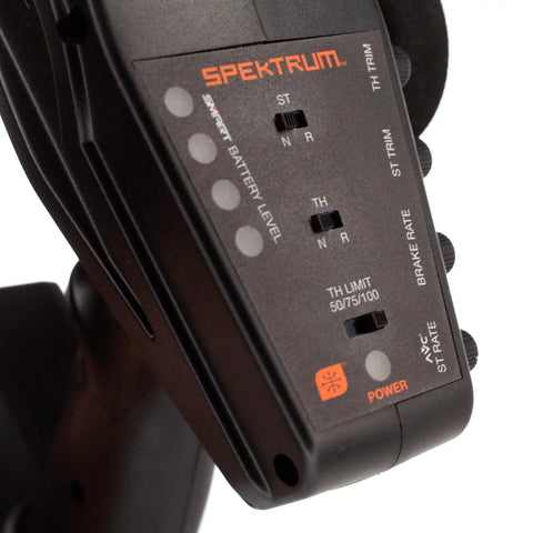 DX3 Smart Three Channel Transmitter With SR315 Receiver for RC Cars, close-up of controls including steering, throttle, and battery indicator.