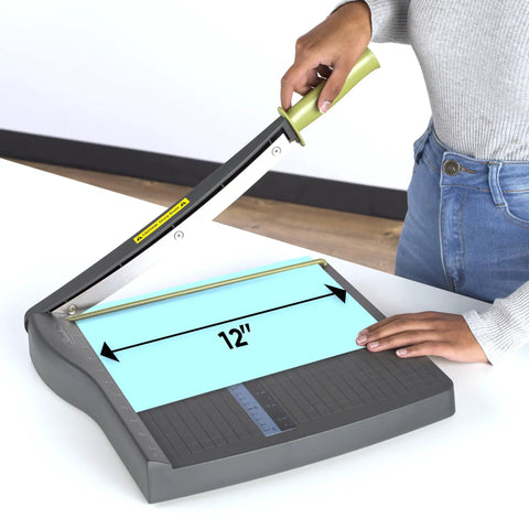 ClassicCut Lite 12 Inch Guillotine Paper Cutter with user demonstrating 12-inch cutting length and sturdy plastic base.