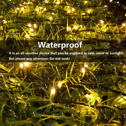 Solar Powered Outdoor Fairy String Lights 39Ft 100 LED Waterproof Twinkle With 8 Modes And Memory Function glowing on grass.