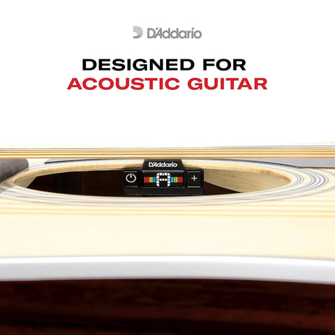 Close-up of soundhole clip-on tuner for acoustic guitars and ukuleles, featuring a non-marring clip and piezo sensor in the sound hole.