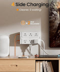 Massive Heavy Duty Surge Protector Power Strip With Twelve Roomy Outlets And Six Fast Charge USB Ports Featuring An Insanely Slim Flat Plug Cable And Zero Tangle Design Perfect For Bedroom Couch Setup mounted on wall with devices plugged in, showing clean setup.