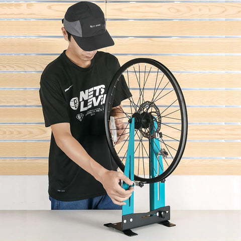 Person using Bicycle Wheel Truing Stand For 16 To 29 Inch Wheels, Adjustable Width 95Mm To 150Mm, Carbon Steel Construction