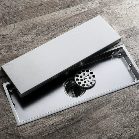 Top Shelf Heavy Duty 304 Stainless Steel Linear Floor Drain With Anti Odor Hair Catcher For Bathroom And Shower Tile Insert Rectangle Black Gold Finish. View of sleek stainless steel drain with removable cover.