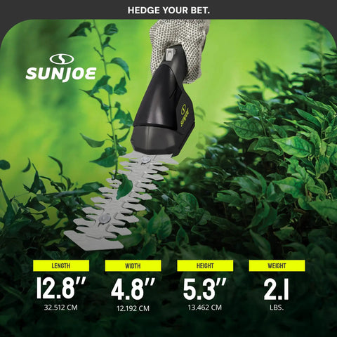 2-In-1 Cordless Grass Shears And Hedge Trimmer For Quick Edging And Shrubs in use on green hedge