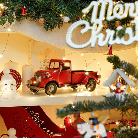 Iron Classic Red 12 Inch Pickup Truck Figurine For Home Decor on festive Christmas shelf with lights and decorations